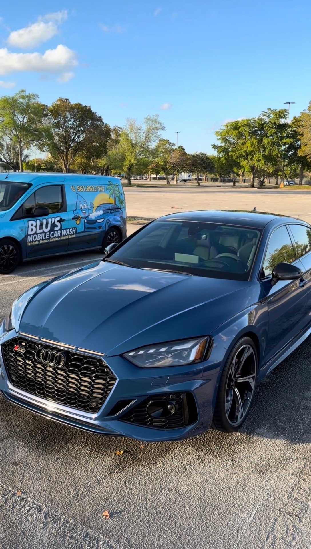 Nardo blue Audi RS5 next to BLU'S mobile car wash van